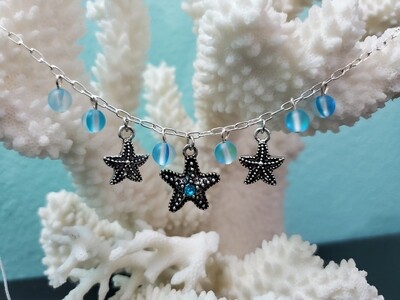 Antique silver starfish with blue beads