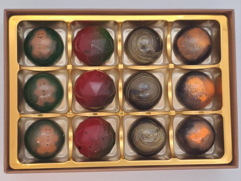 Gingerbread Ganache, Passionfruit &amp; White Chocolate, Baileys &amp;  Pumpkin Spiced Latte. Box of 12