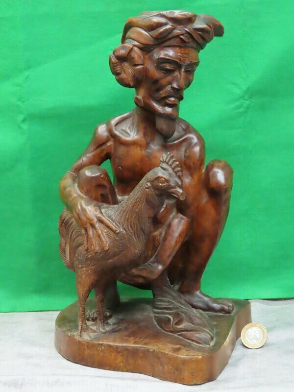 Carved Wood Sculpture .