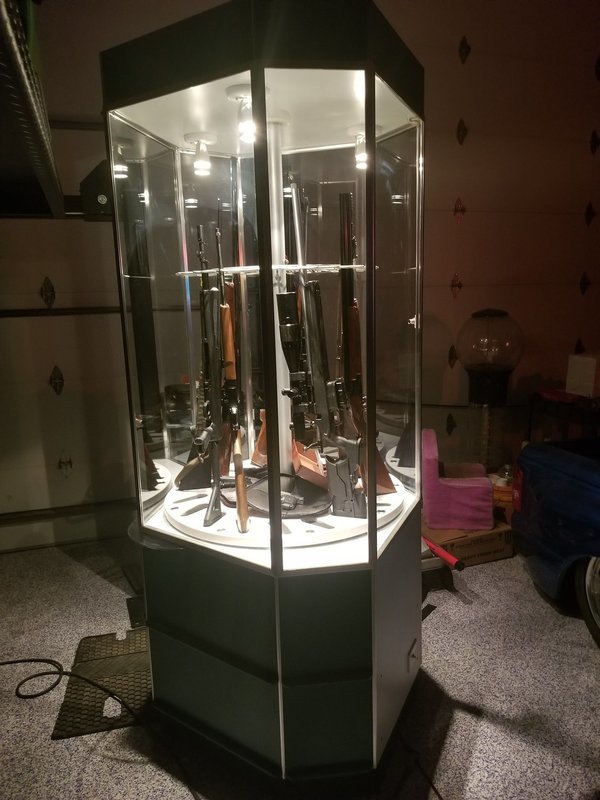 18  Revolving &amp; Lighted Gun cabinet
