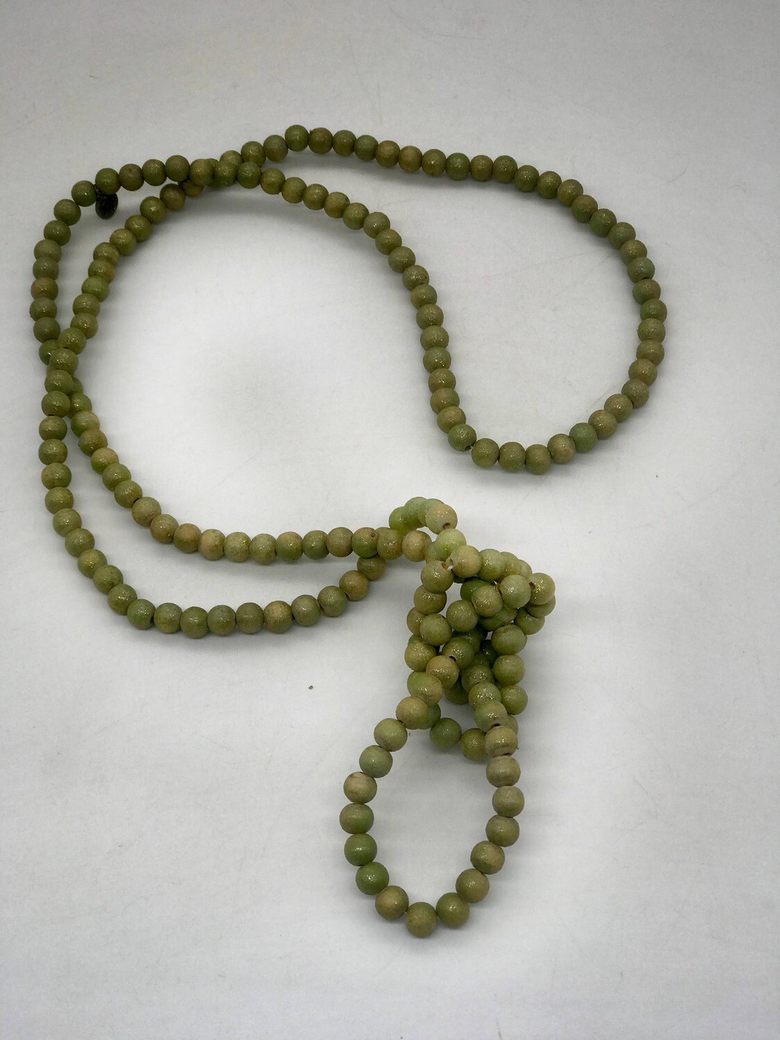 A Rare Bird Teakwood Assorted Necklaces