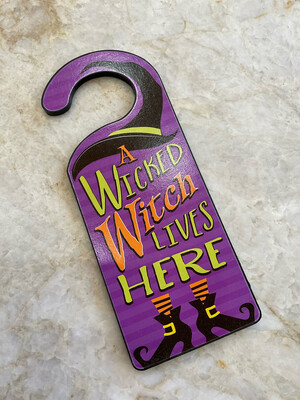 A Wicked Witch Lives Here Door  Knob Sign 
