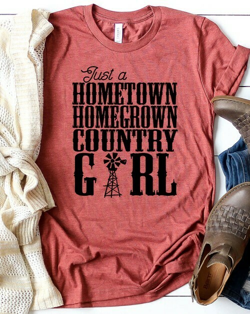 These shirt is a beautiful heather clay color. Coming from a small town, this shirt just speaks to my heart❤️