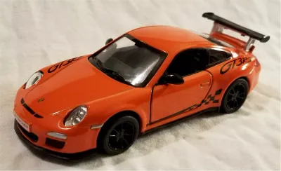 KINSMART 2010 Porsche 911 GST RS 1:36 orange