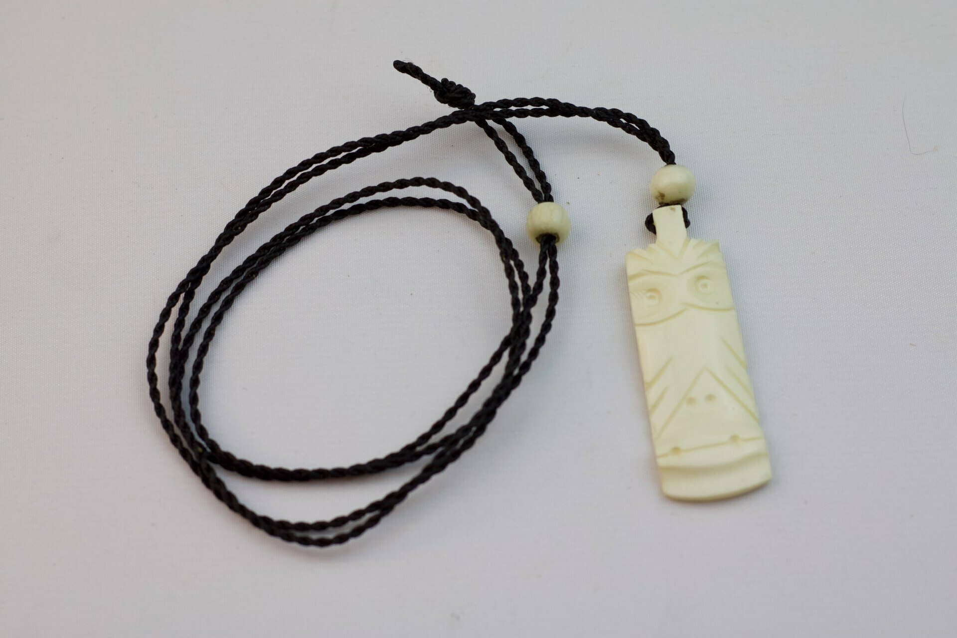 Carved Bone Tiki Pendant on Adjustable Hand Braided Black Cord