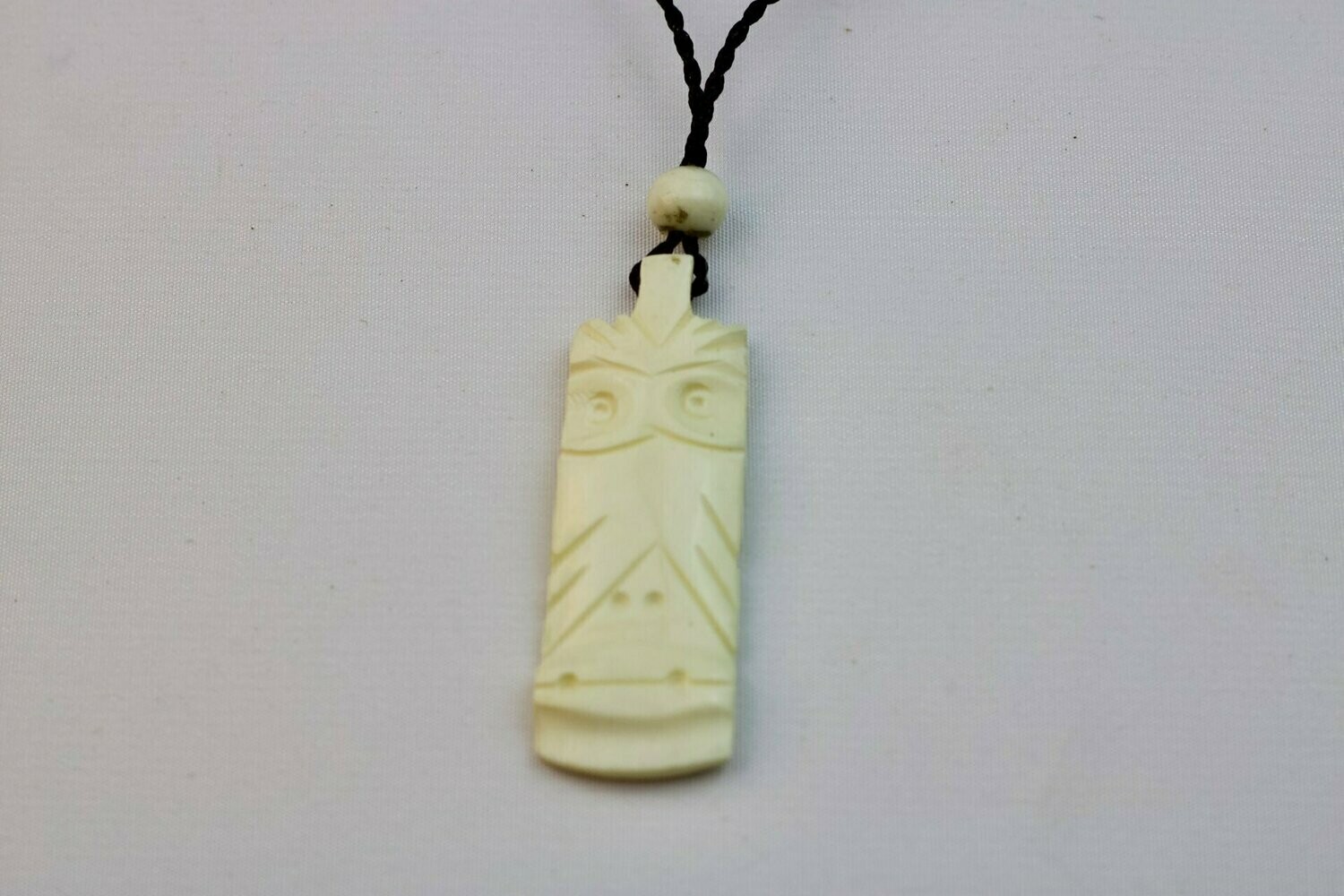 Carved Bone Tiki Pendant on Adjustable Hand Braided Black Cord