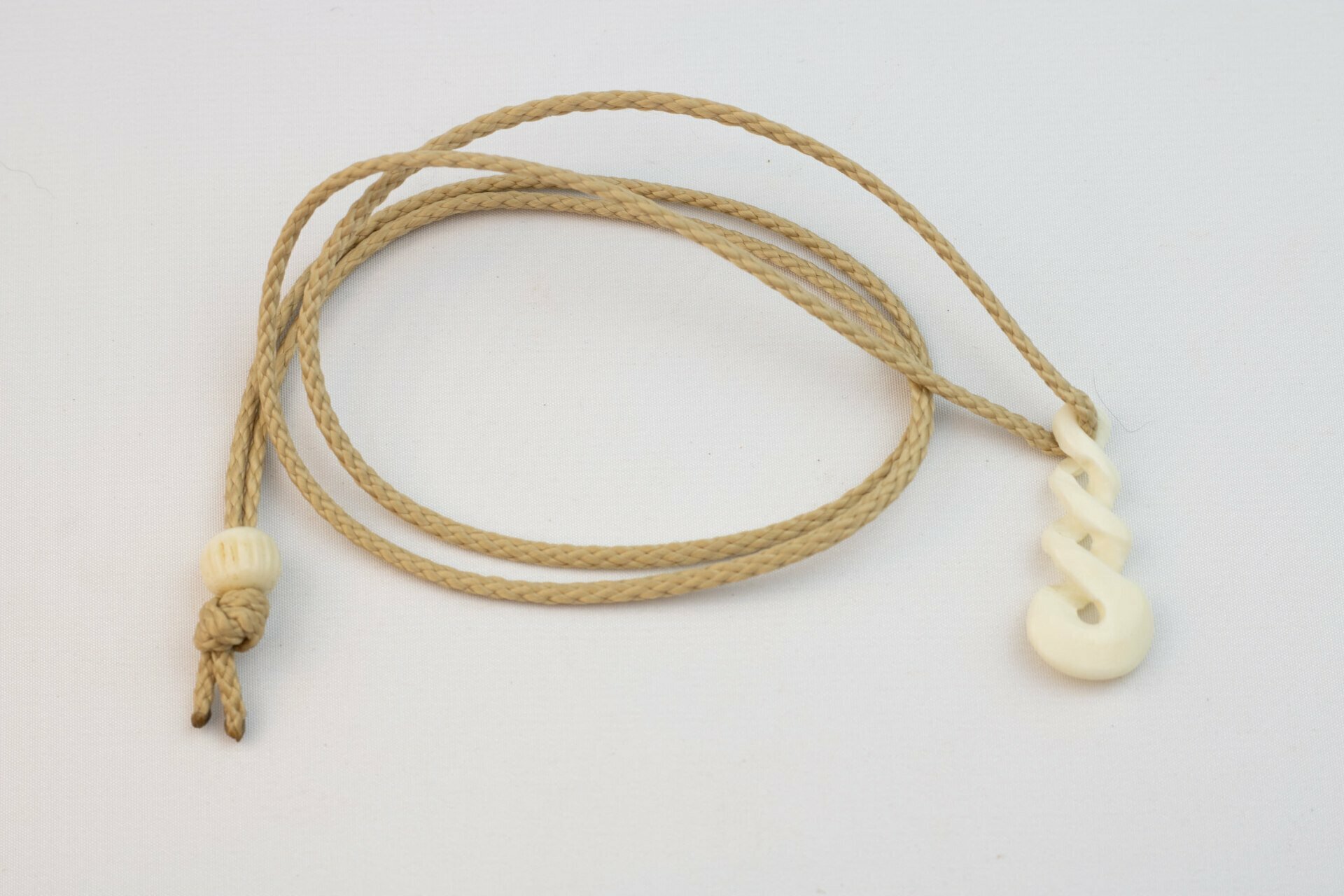 Bone Pikorua Pendant on Adjustable Hand Braided Tan Cord