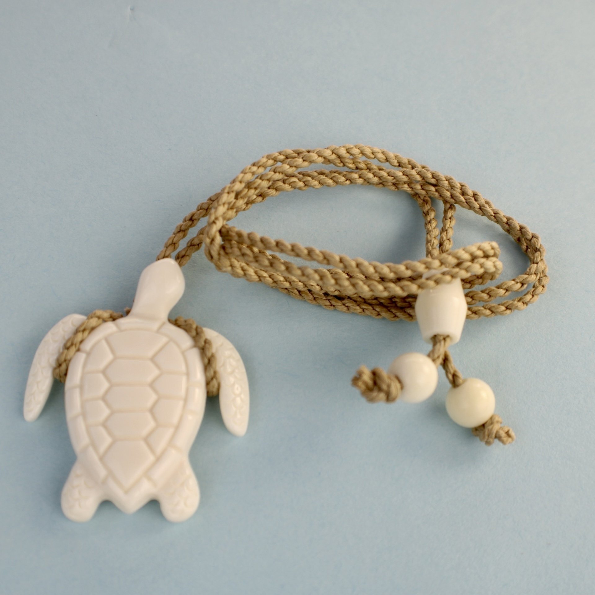 Hawaiian Bone Turtle Honu Pendant on Adjustable Hand Braided Tan Cord