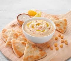 Dockside Classic Greek Hummus with Mediterranean Pita Chips. Order by Phone, In-Store and ONLINE (including local delivery).