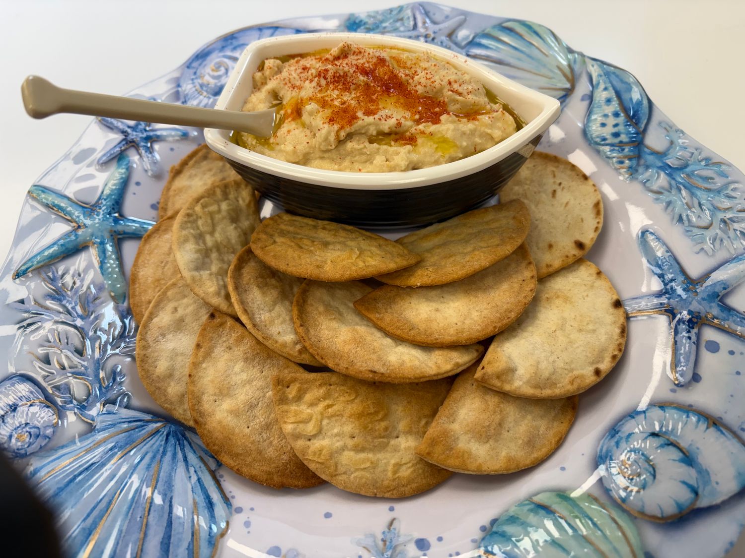 Dockside Classic Greek Hummus with Mediterranean Pita Chips. Order by Phone, In-Store and ONLINE.