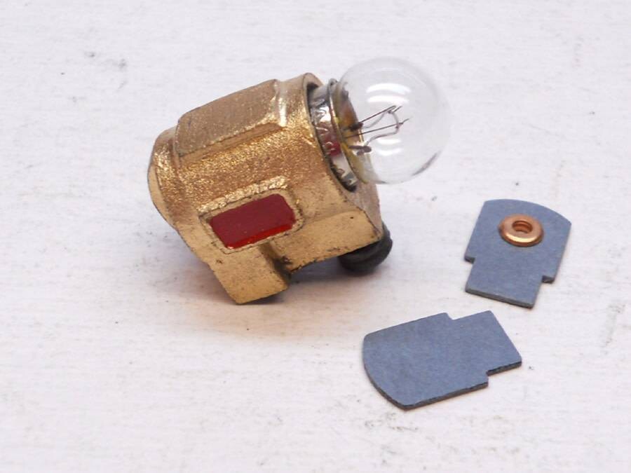 HEADLIGHT, DIECAST, complete, for Chicago "O" Electric; gold; 9/16" tall; includes fiber inserts, screw, & bulb