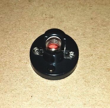 LAMP SOCKET IN BASE: for 432-1447-526-etc bulbs; with screw terminals; base = 1" tall; 1-1/4" wide; has screw-mount holes; good for bldgs