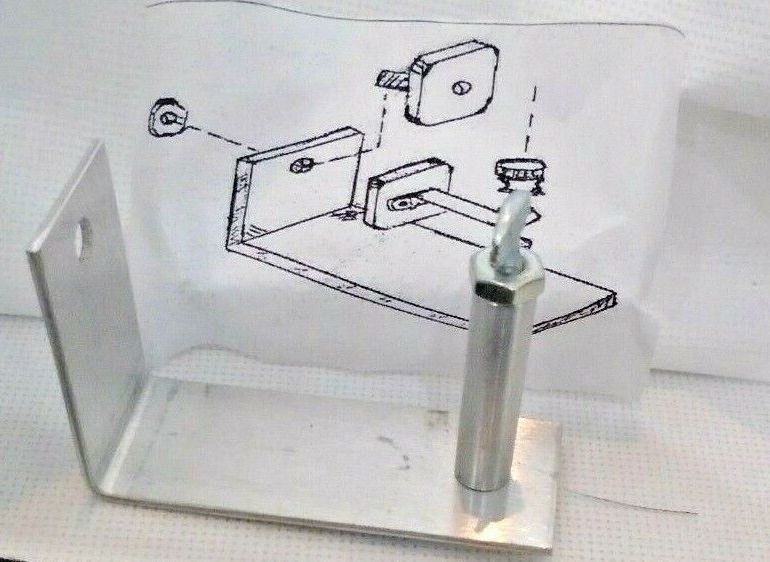BELLOWS REPLACEMENT JIG: properly positions and holds bellows material during installation.