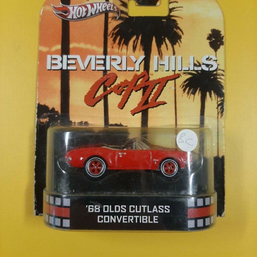 OLDSMOBILE CUTLASS CONVERTIBLE; 1968 ; top down; red; HOT WHEELS;  "Beverly Hills Cop"; (new in pkg); (have 1)