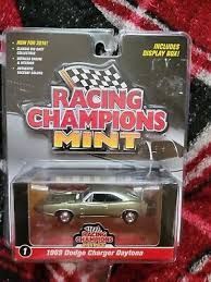 DODGE CHARGER DAYTONA; 1969; silver; RACING CHAMPIONS; (new in pkg); (have 1)