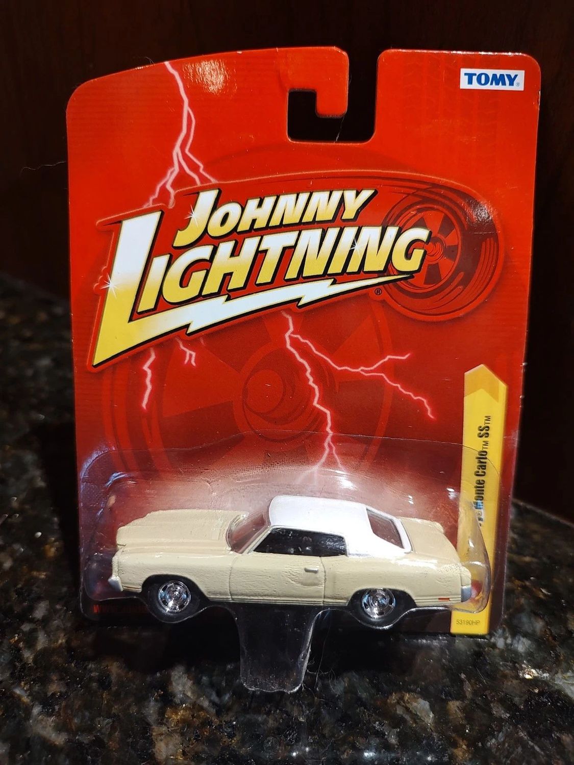 CHEVROLET MONTE CARLO; 1970; beige & white; Johnny Lightning; (new in pkg); (have 1)