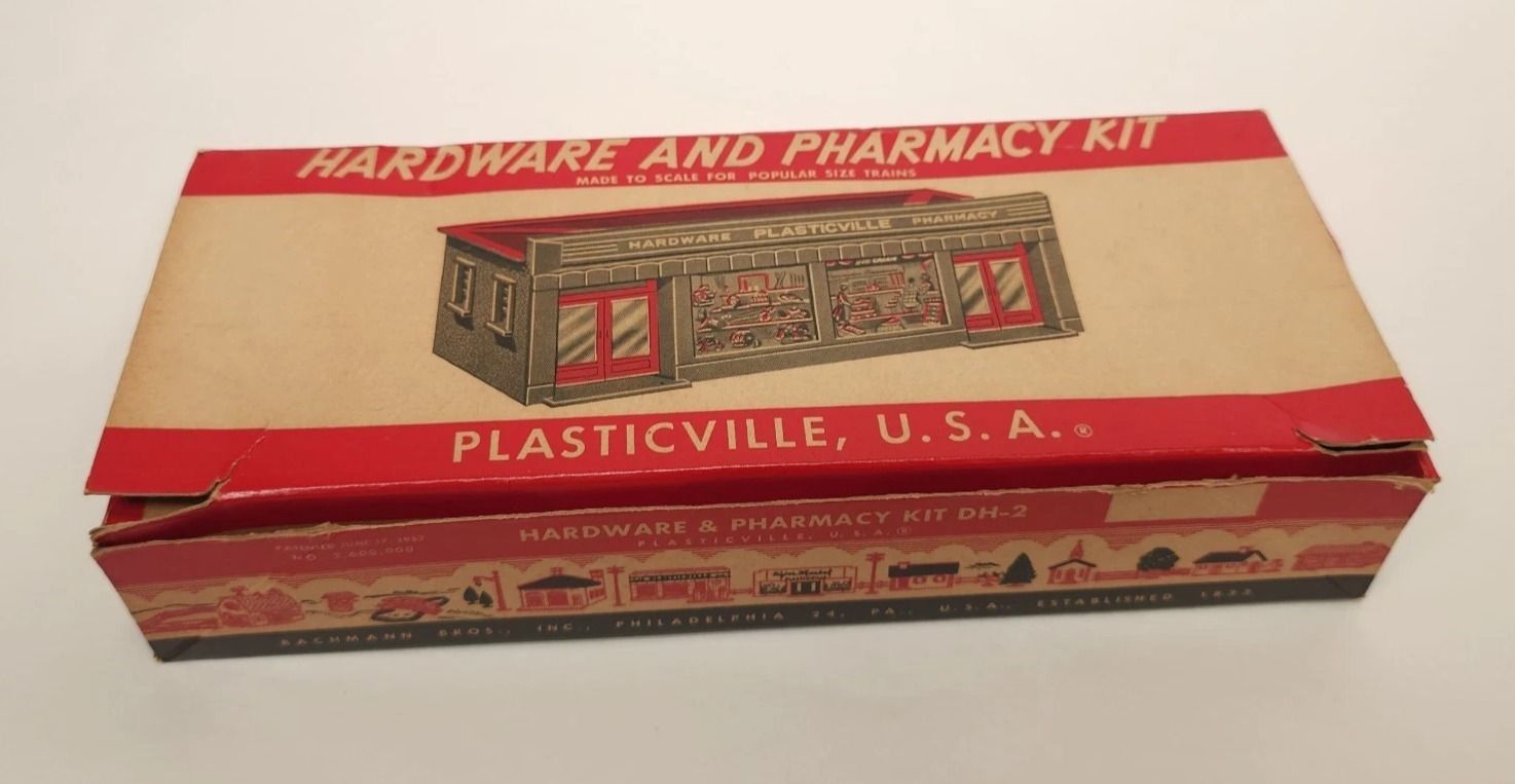 PLASTICVILLE HARDWARE & PHARMACY STORE; DH-2; beige & black; gray roof. LN, boxed. (HAVE 2)
