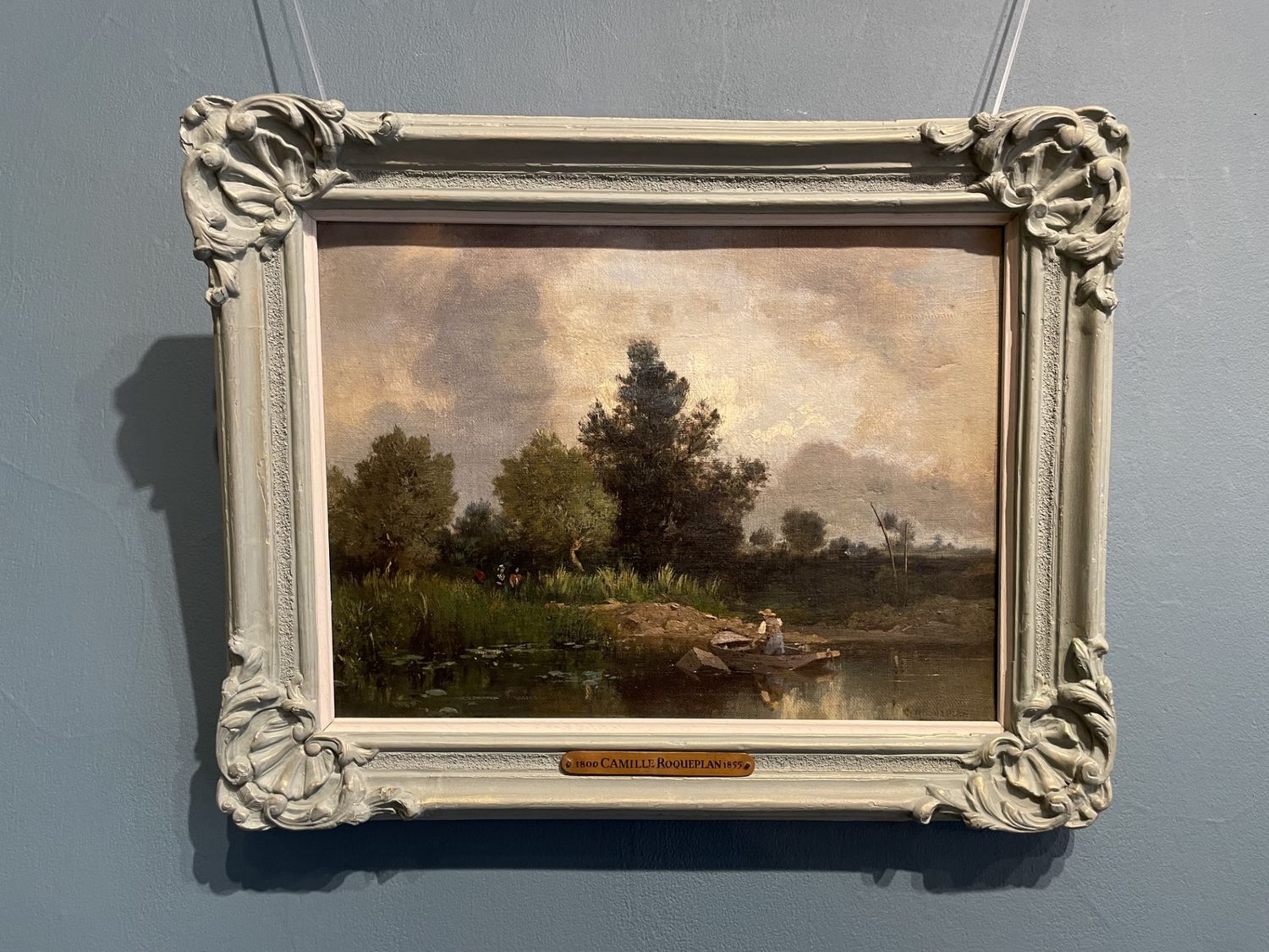 Riverbank Scene with Ferryman and Figures on a Path