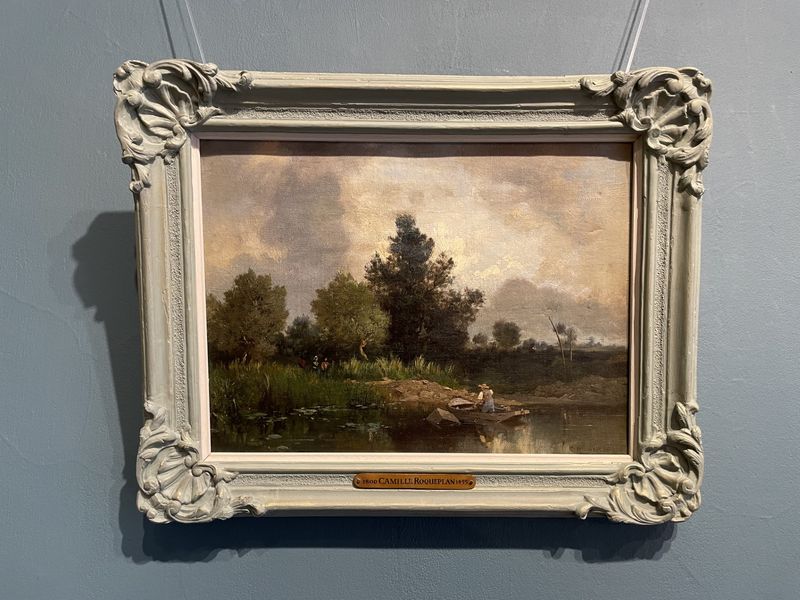 Riverbank Scene with Ferryman and Figures on a Path