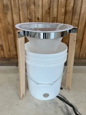 Stand for honey strainer