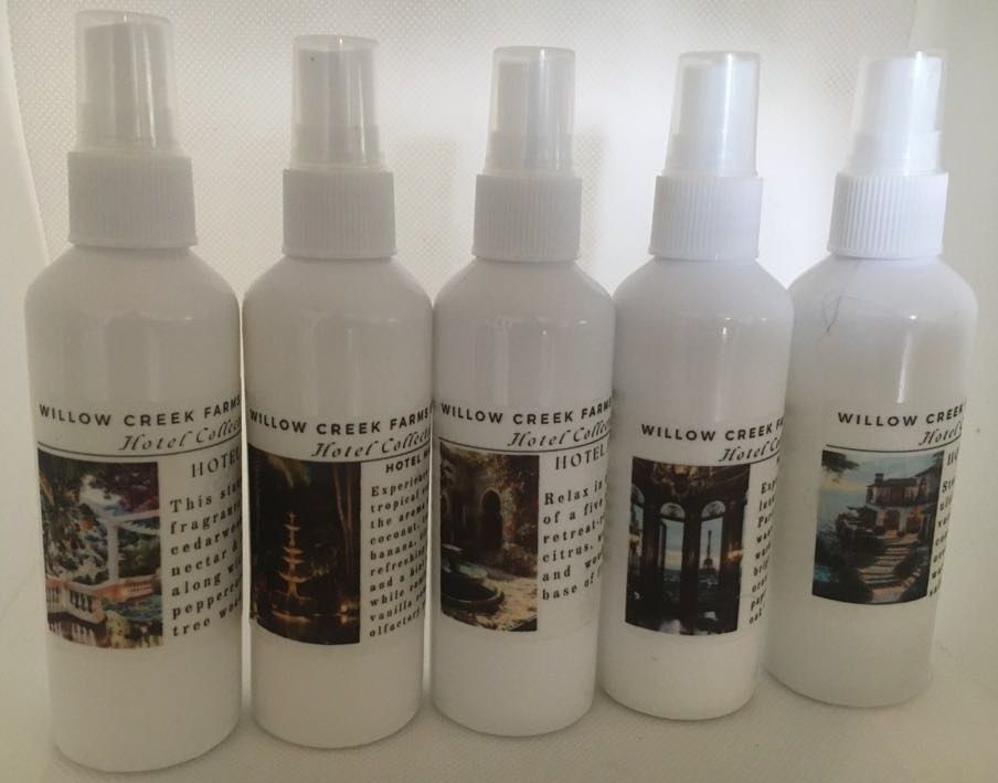 Collection of 5 white spray bottles with labels. 