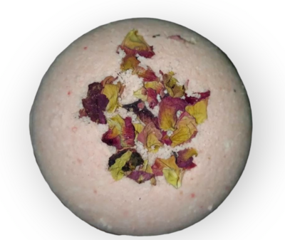 bath bomb with rose petals on white background