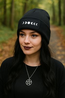 Model wearing moon phases beanie outdoors in autumn forest