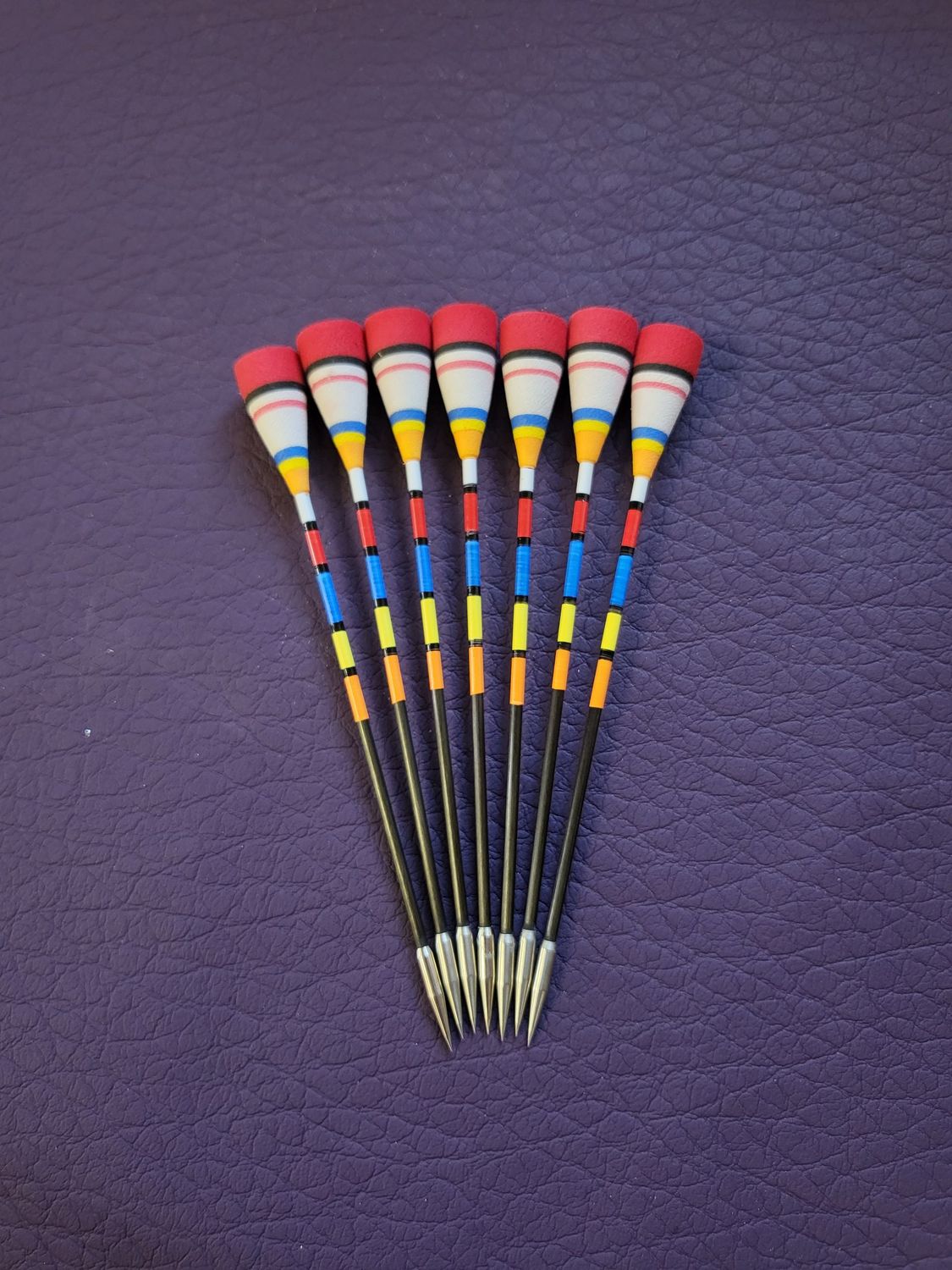 Pfeil mit Indonesischer Schaumkone. Satz mit 7 Pfeile