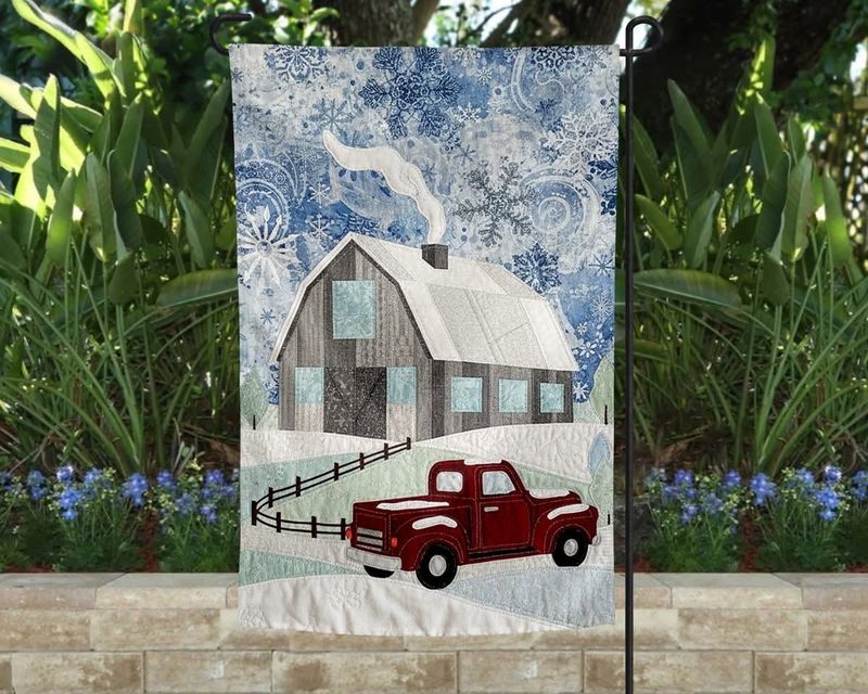 blue barn in snow