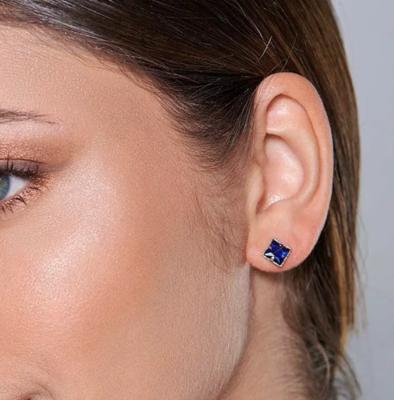 Gold-plated equilibrium earring with blue crystal