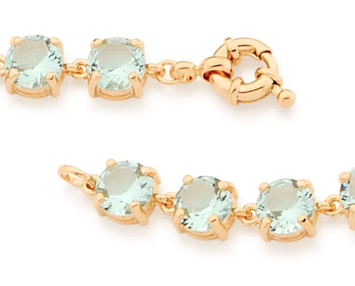 Gold-plated bracelet with light green crystal