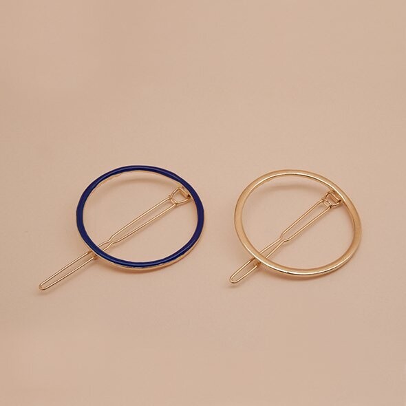 Gold-plated round hair clip hand-enameled in dark green