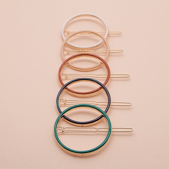 Gold-plated round hair clip hand-enameled in dark green