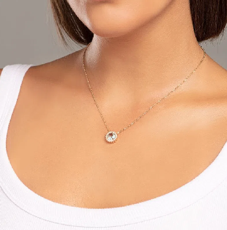 Gold-plated necklace with light blue crystal and white zirconia