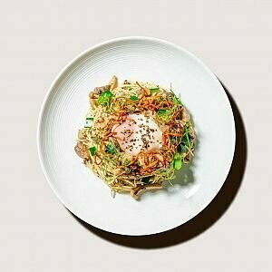 Veggie Truffle Pasta topped with asparagus and onsen egg