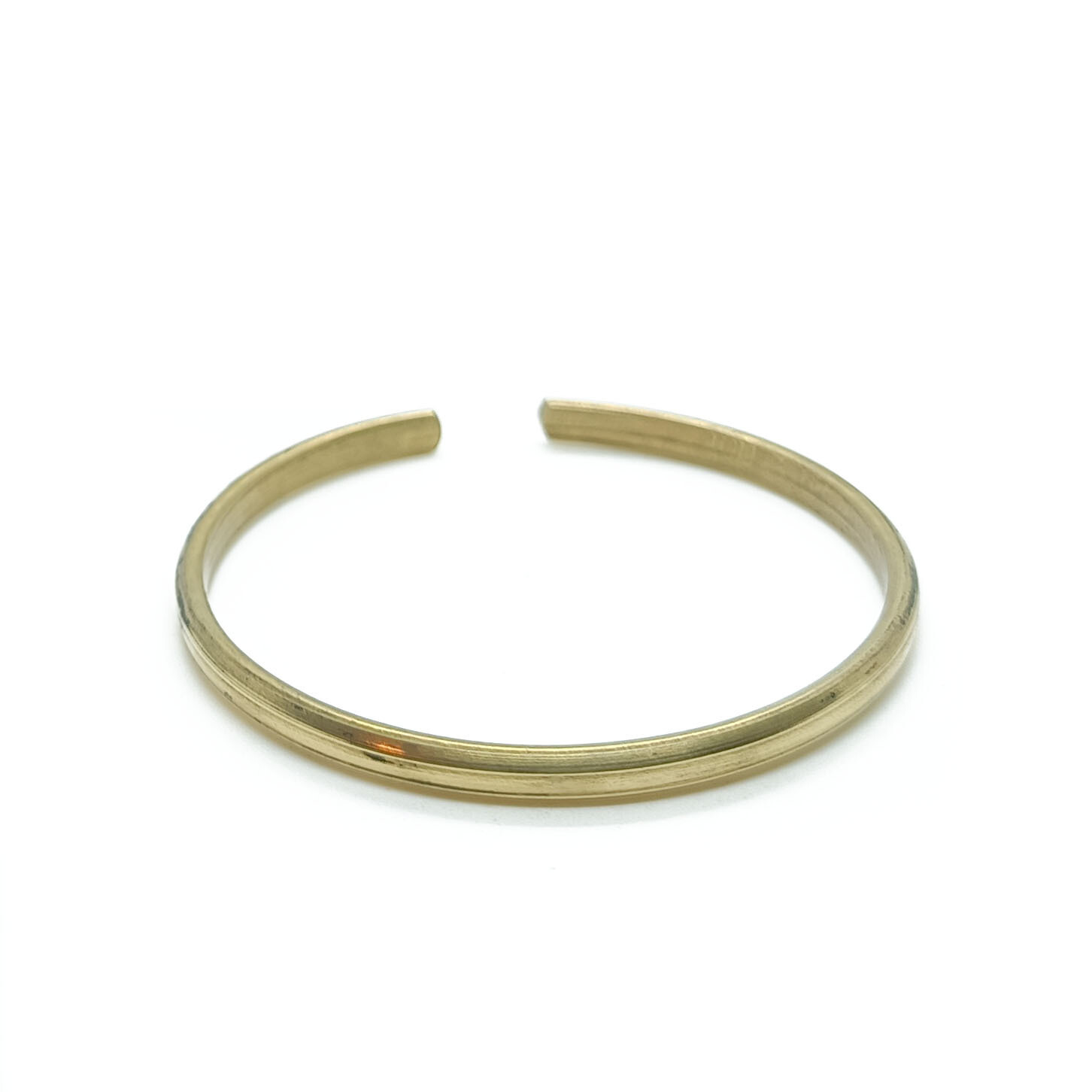 Adjustable brass bangle
