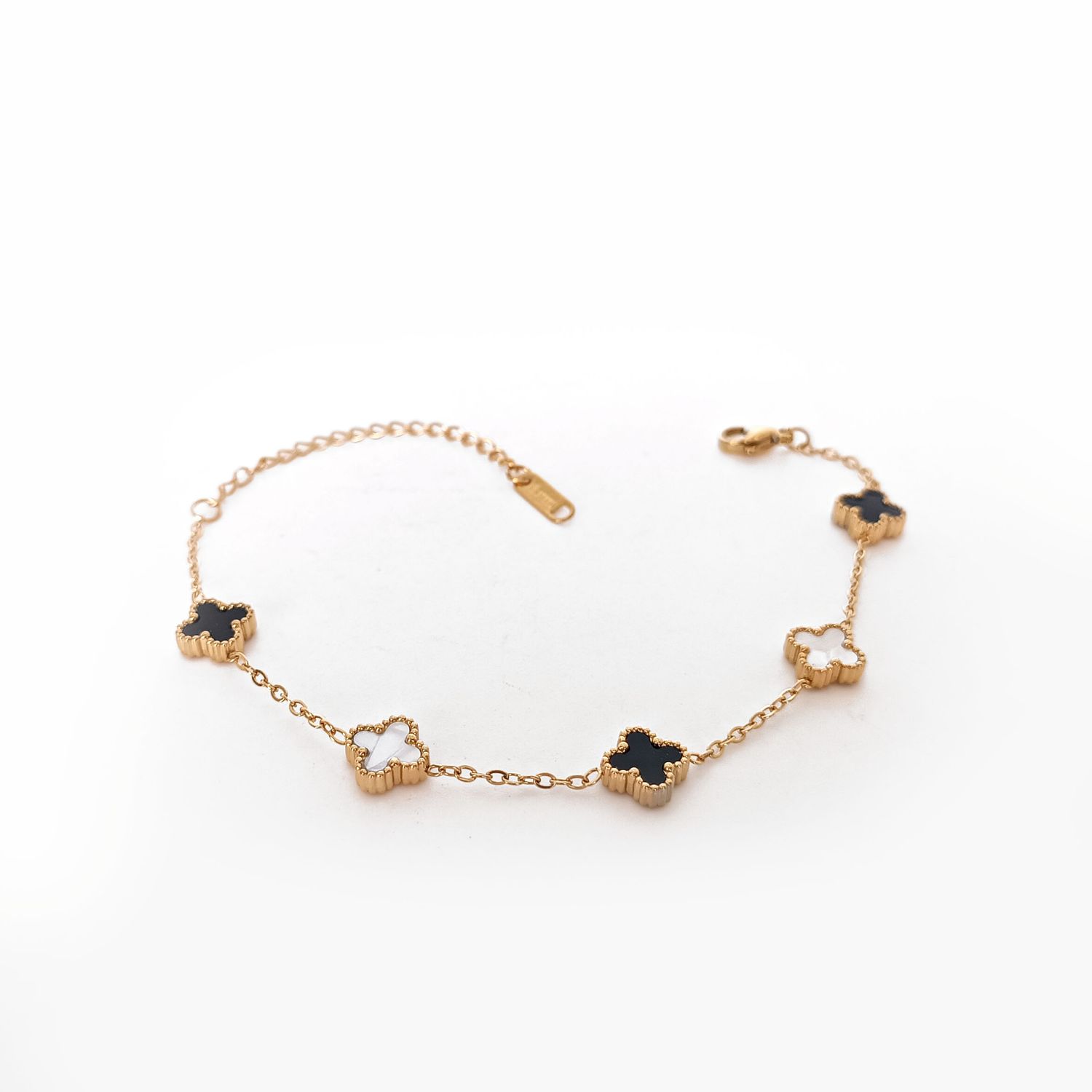 Black &amp; White Clover Bracelet – Gold-Toned Balance with Bold Elegance