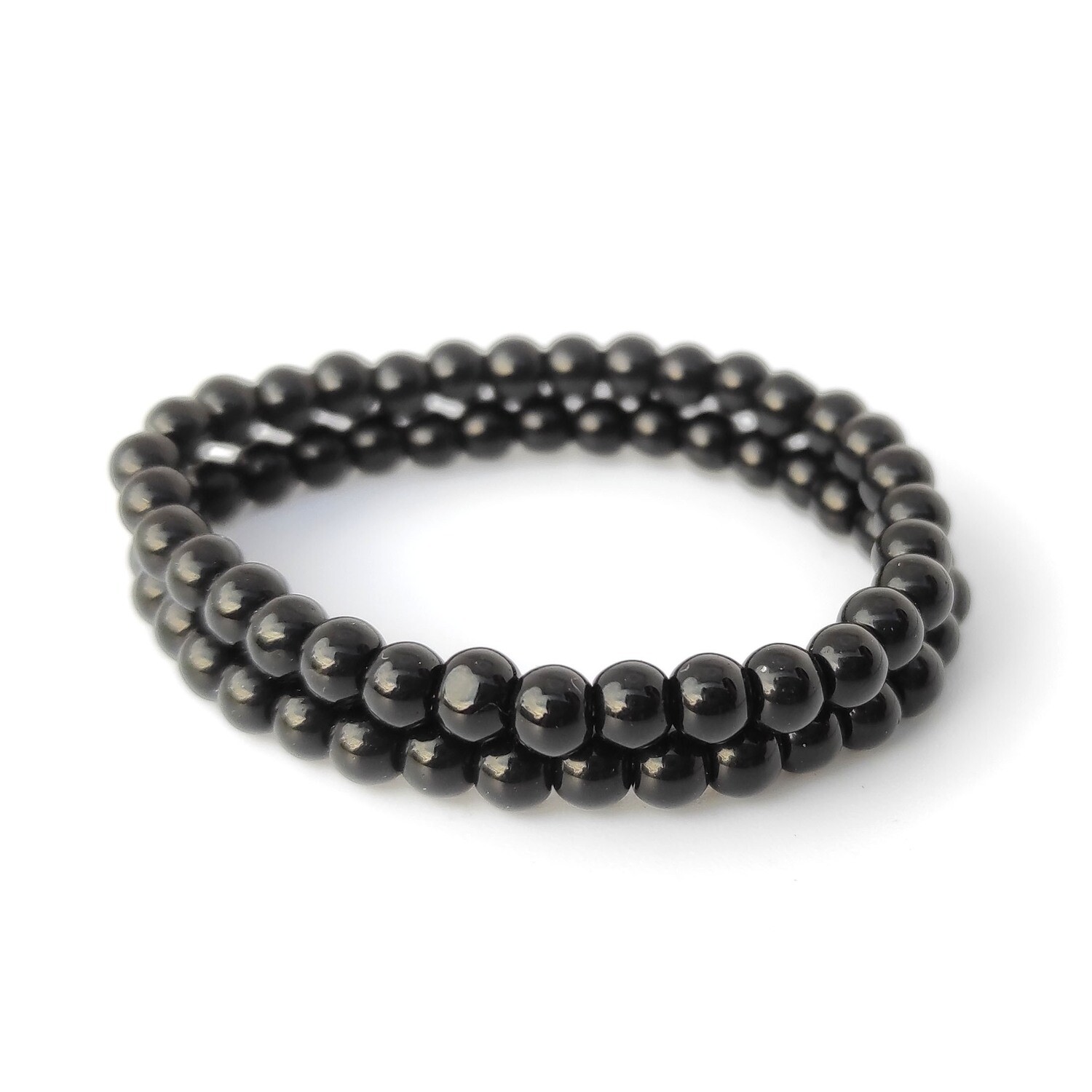 Baby Nazar bracelets set with black beads on a stretch cord, handmade protection jewellery for babies