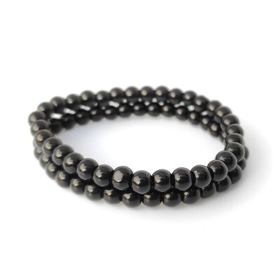 Baby Nazar bracelets set with black beads on a stretch cord, handmade protection jewellery for babies