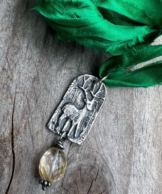 Stag pendant in silver with gorgeous rutilated quartz