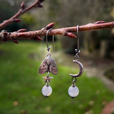 Moth and crescent moon earrings with moonstone beads.