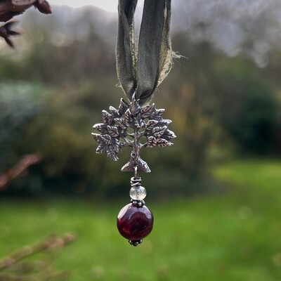 Apple tree ribbon pendant with garnet and labradorite..