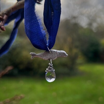 Seal Selkie ribbon pendant with iolite.
