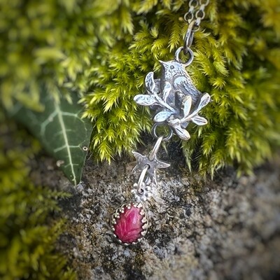 Tiny Robin in tree pendant with set carved ruby, and silver star
