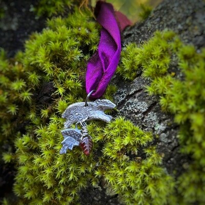 Badger on purple ribbon pendant with silver toadstool and carved red garnet leaf.