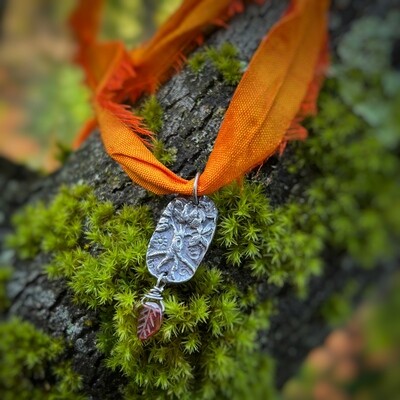 World Tree ribbon pendant with phrenite briolette.