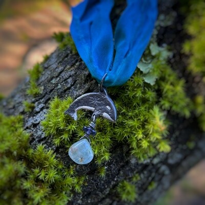 Orca ribbon pendant with aquamarine briolette and iolite .