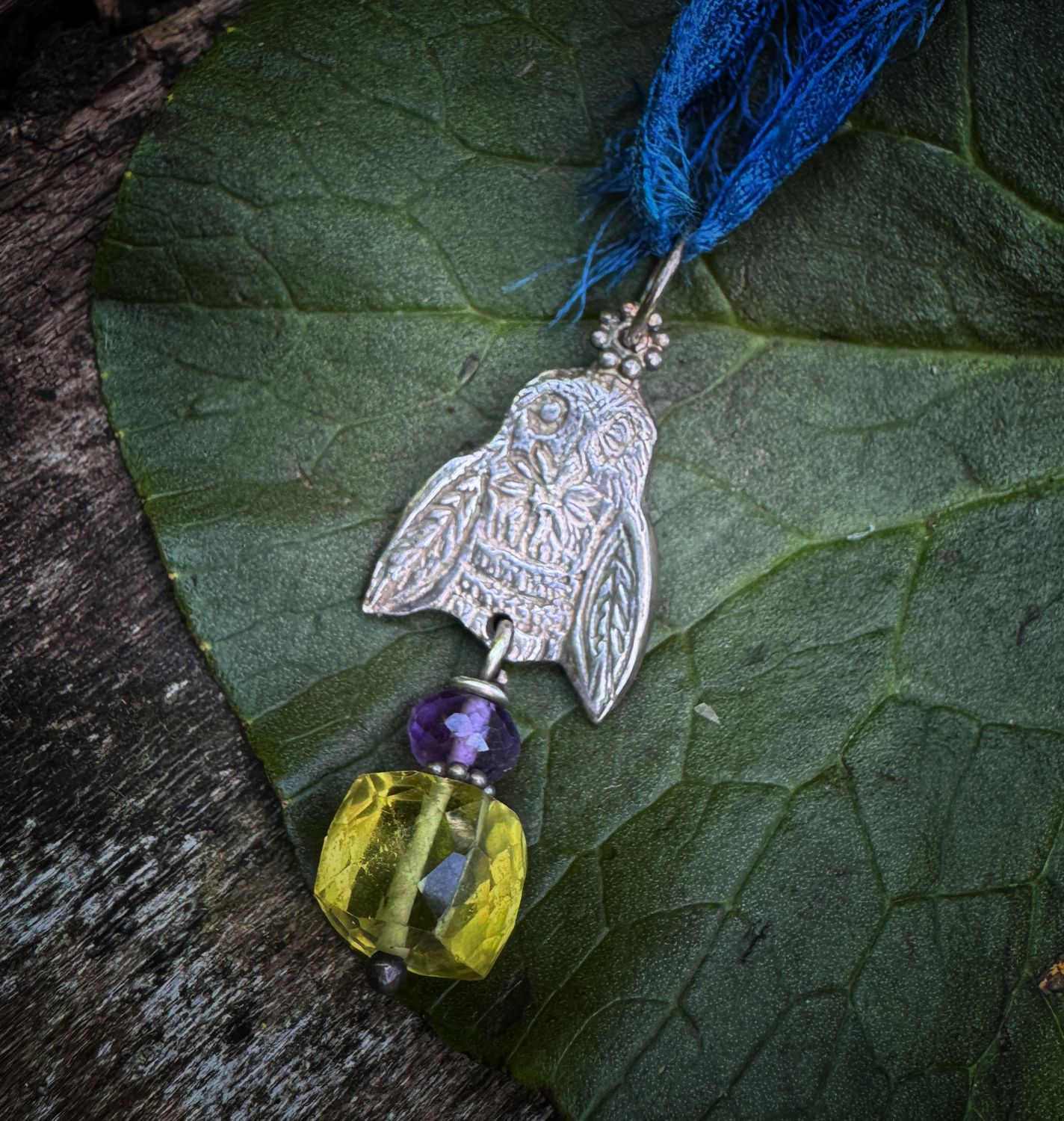 Bee pendant on recycled sari silk ribbon