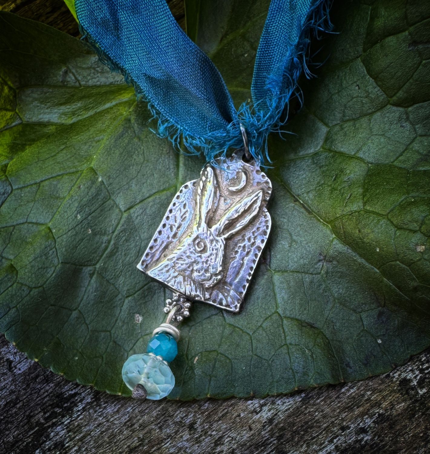 Hare pendant on recycled sari silk ribbon