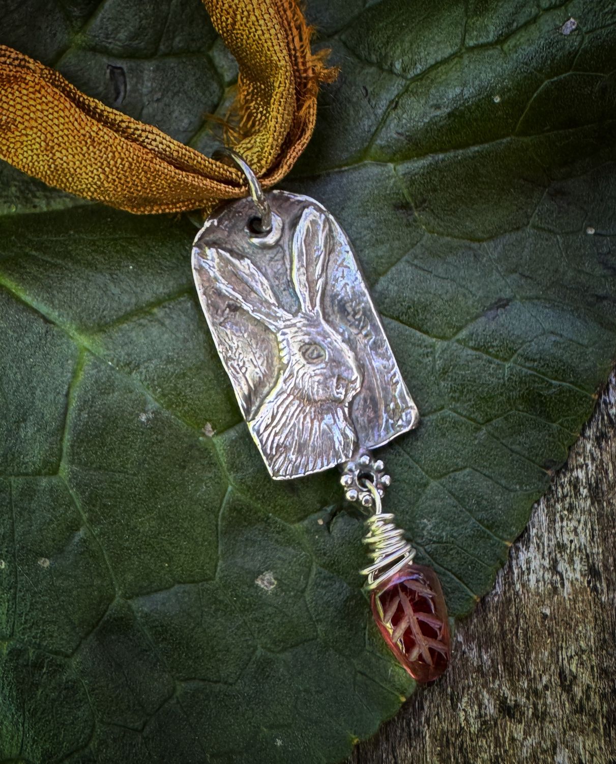 Hare pendant on recycled sari silk ribbon